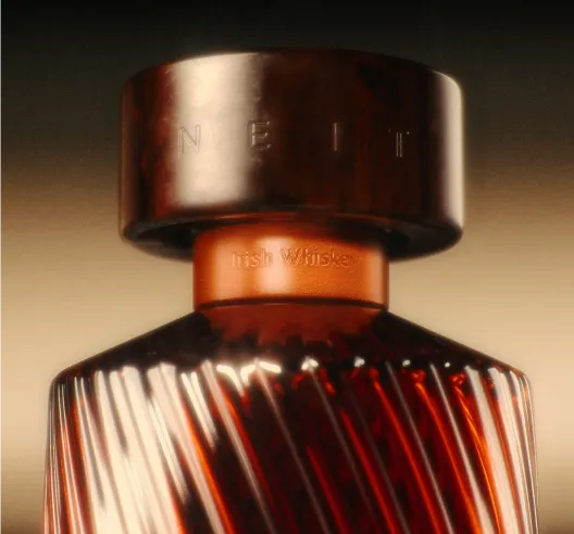 Close-up of a whiskey bottle with 'NEIT' branding on a dark background